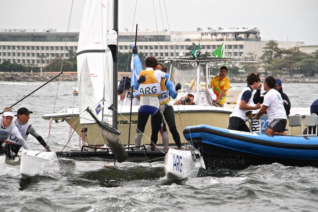 Santiago Lange and Cecilla Saroli (ARG) celebrate after winning the Gold Medal in the  Nacra 17 Medal race. Summer Olympics © Richard Gladwell www.photosport.co.nz